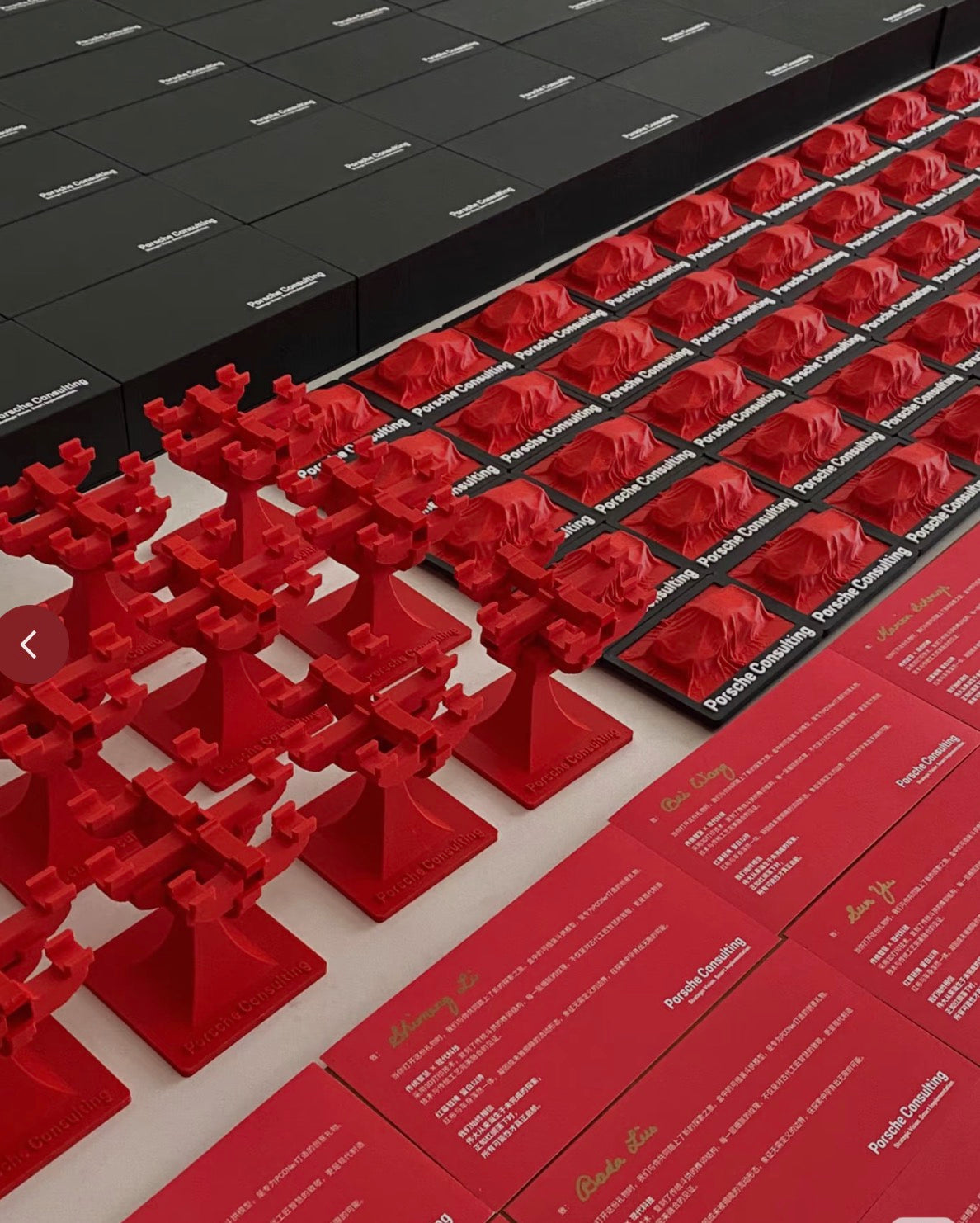 Empowering Brand Value: Premium 3D printed tree-shaped trophies and plaques by owl3dmesh for Porsche Consulting are showcased with branded boxes, exemplifying unique corporate gifts crafted for maximum brand impact.